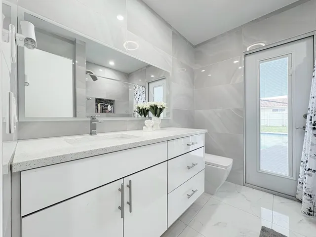 $825,000 | 1861 Caribbean Road West, Lake Clarke Shores, FL 33406