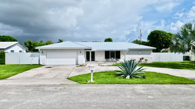 $825,000 | 1861 Caribbean Road West, Lake Clarke Shores, FL 33406