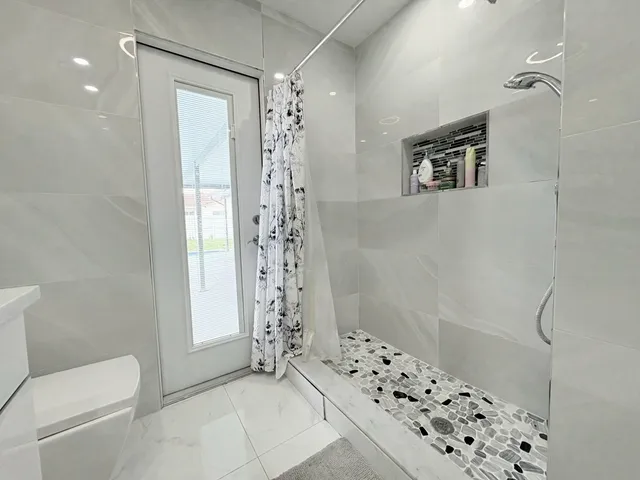 $825,000 | 1861 Caribbean Road West, Lake Clarke Shores, FL 33406