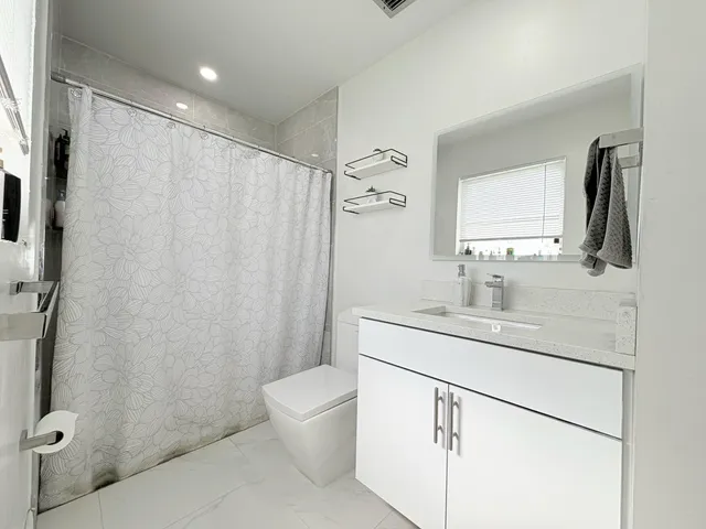 $825,000 | 1861 Caribbean Road West, Lake Clarke Shores, FL 33406