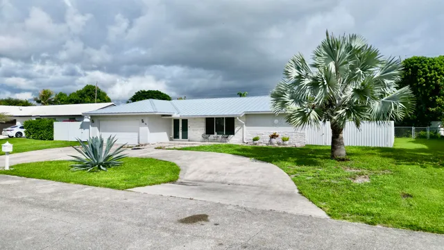 $825,000 | 1861 Caribbean Road West, Lake Clarke Shores, FL 33406