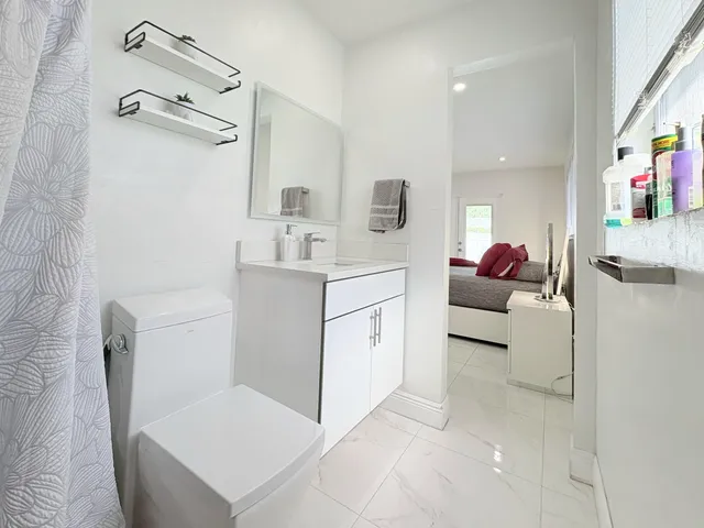 $825,000 | 1861 Caribbean Road West, Lake Clarke Shores, FL 33406