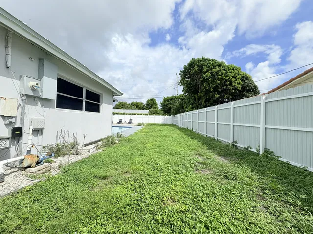 $825,000 | 1861 Caribbean Road West, Lake Clarke Shores, FL 33406