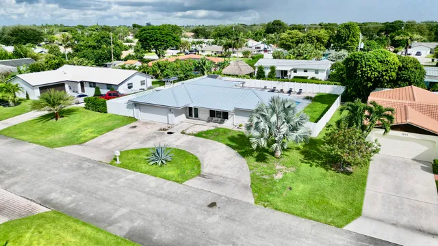 $825,000 | 1861 Caribbean Road West, Lake Clarke Shores, FL 33406