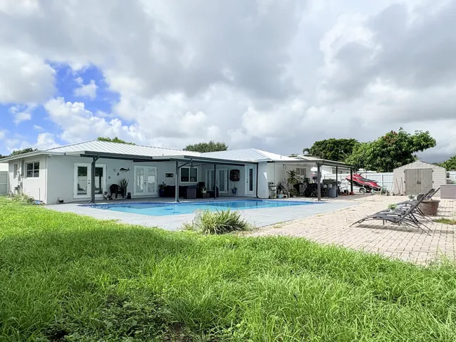 $825,000 | 1861 Caribbean Road West, Lake Clarke Shores, FL 33406
