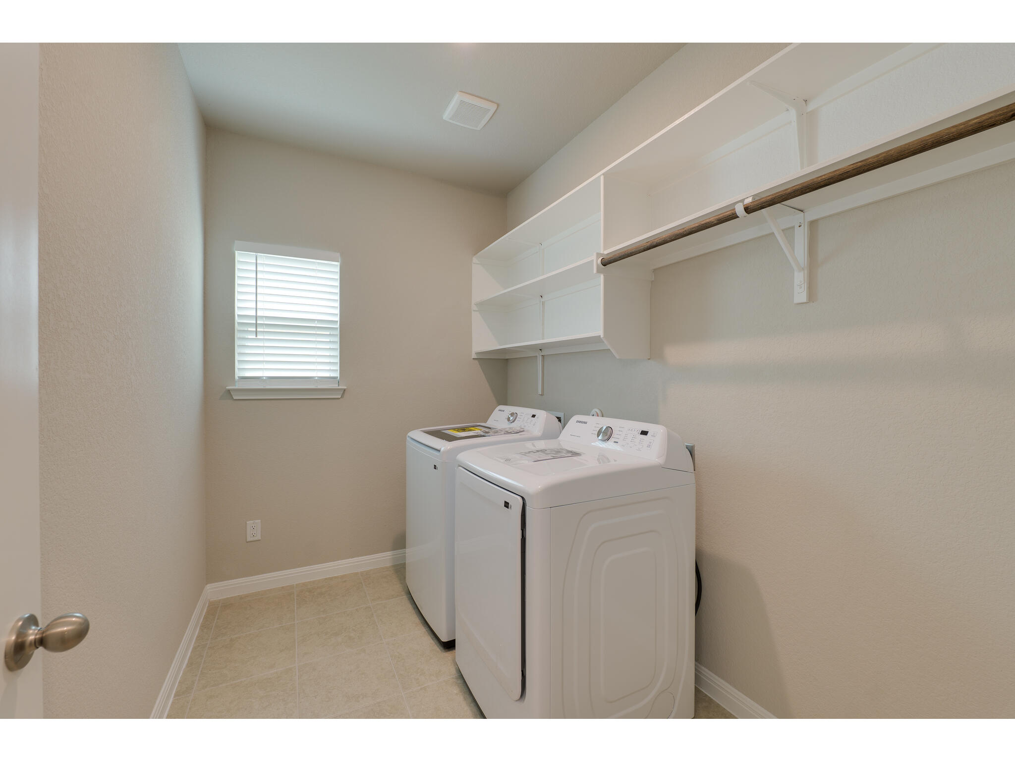111 Grapefruit Road Hutto, TX 78634 - Photo 25 of 39 Laundry room featuring separate washer and dryer and baseboards