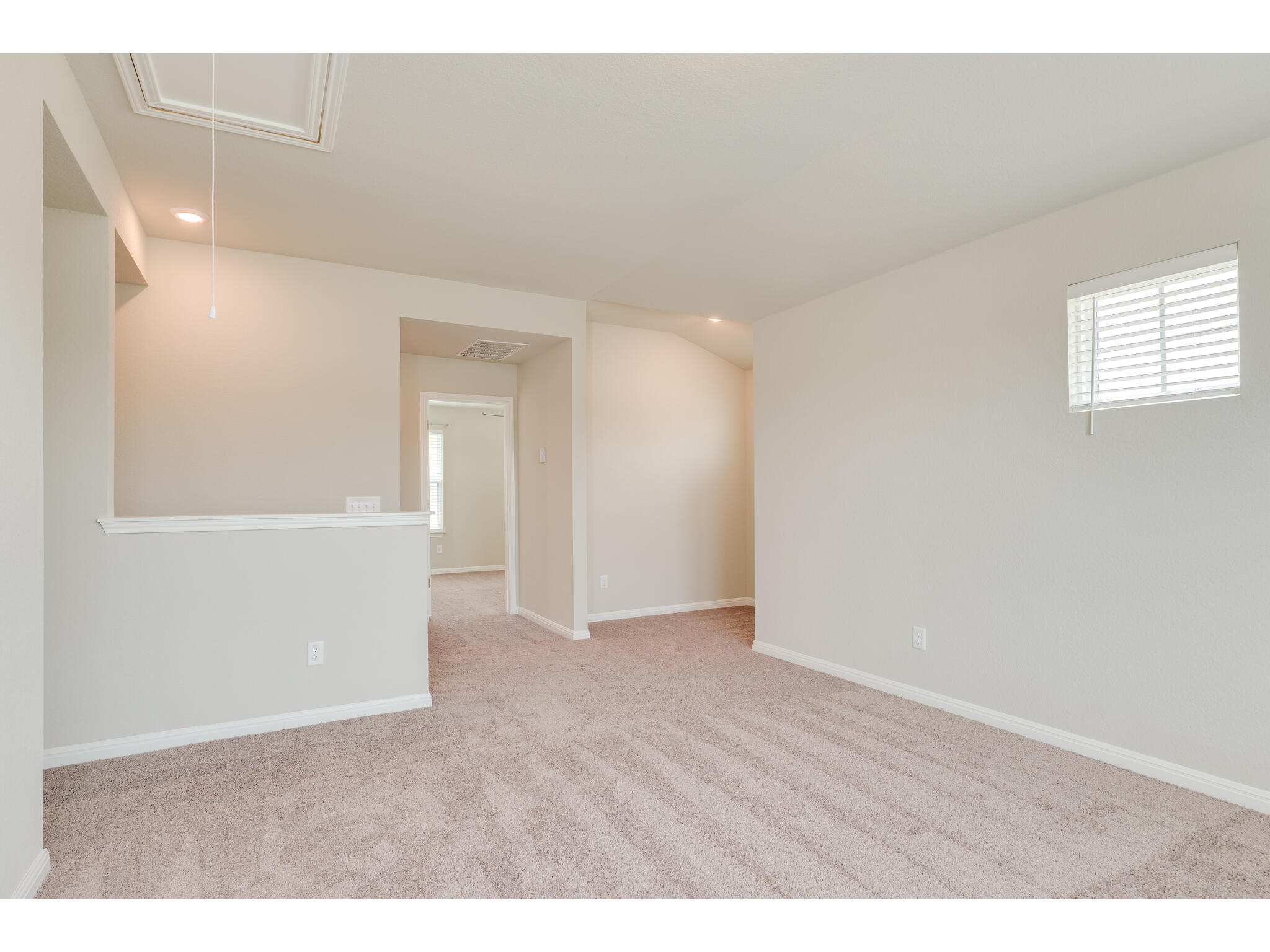 111 Grapefruit Road Hutto, TX 78634 - Photo 28 of 39 Carpeted empty room with attic access, recessed lighting, and baseboards