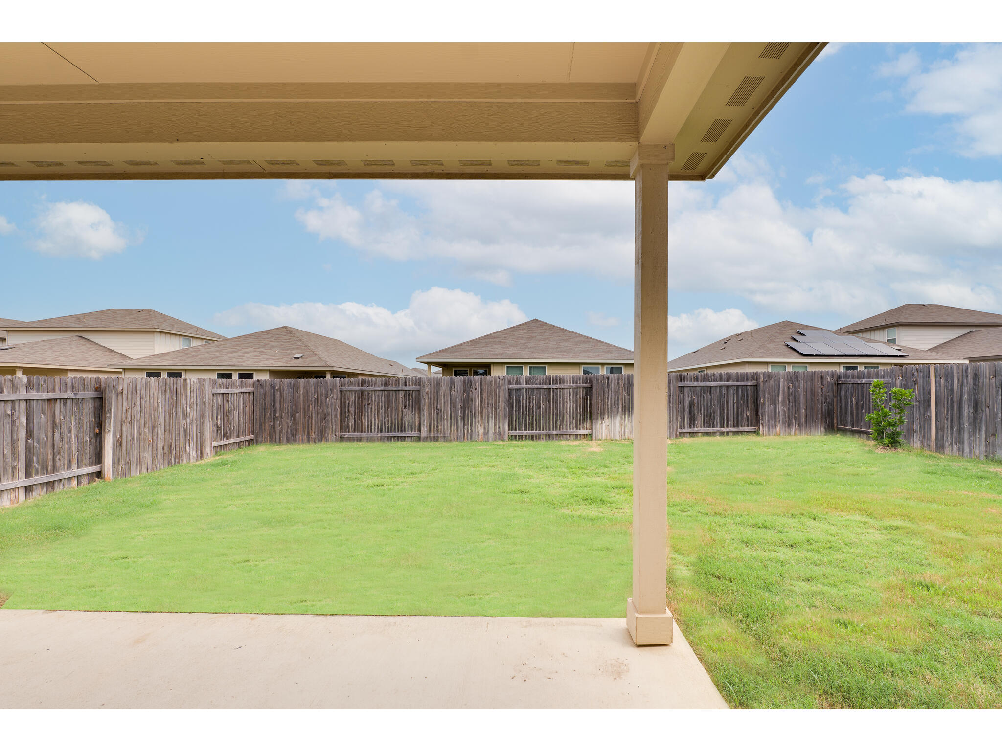 111 Grapefruit Road Hutto, TX 78634 - Photo 34 of 39 View of yard featuring a patio area