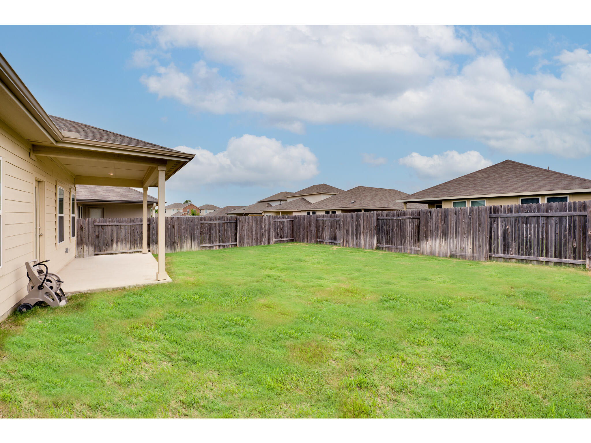 111 Grapefruit Road Hutto, TX 78634 - Photo 37 of 39 View of yard with a patio area