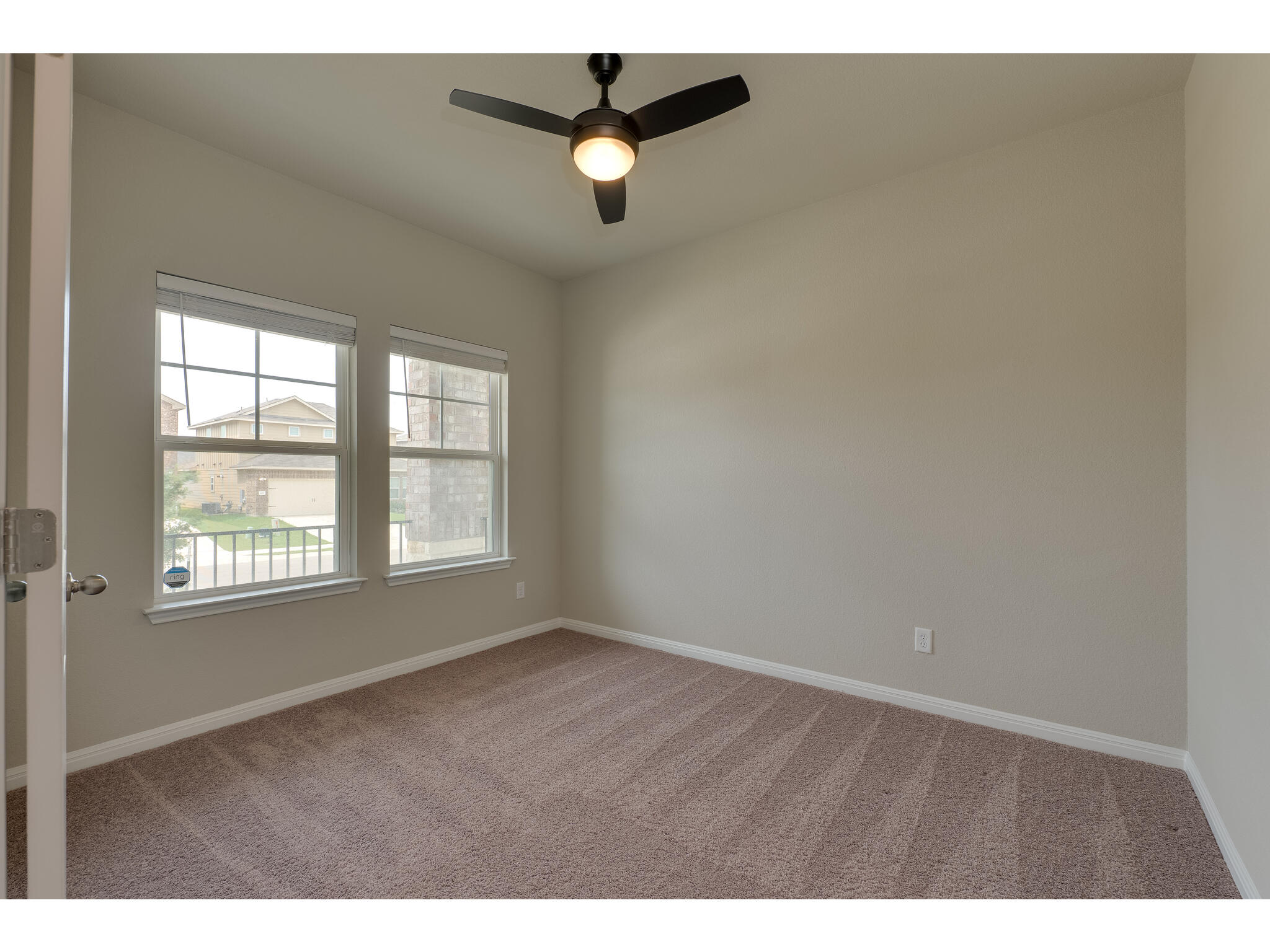 111 Grapefruit Road Hutto, TX 78634 - Photo 9 of 39 Unfurnished room featuring carpet flooring, a ceiling fan, and baseboards
