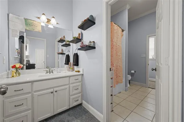 a bedroom with furniture and a chandelier