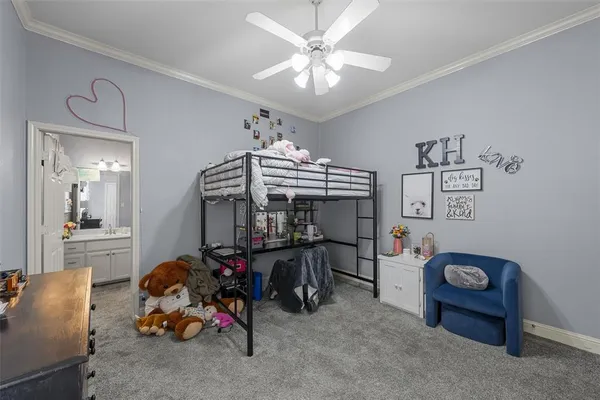 a workspace with furniture a chandelier and a window