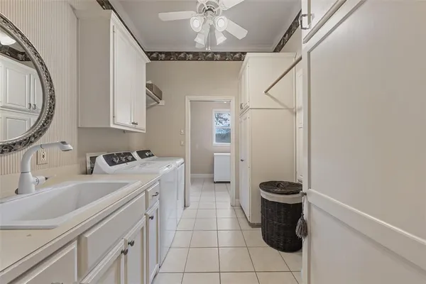 a bathroom with a sink vanity mirror and toilet