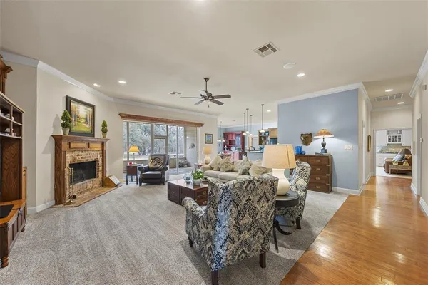 a living room with fireplace furniture and a fireplace