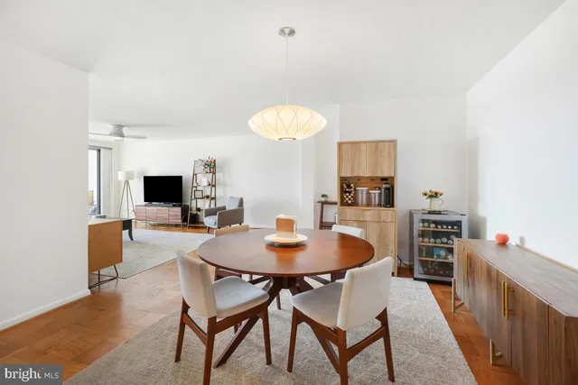 a view of a dining room and a table and chairs