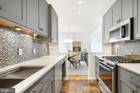 a kitchen with a sink and cabinets