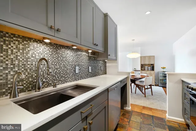 a view of a hallway with wooden floor and entryway