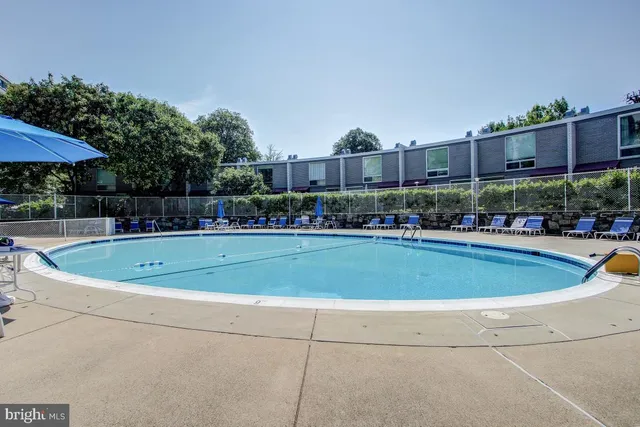a view of a swimming pool with a patio