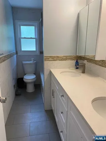 an empty room with a empty space and windows