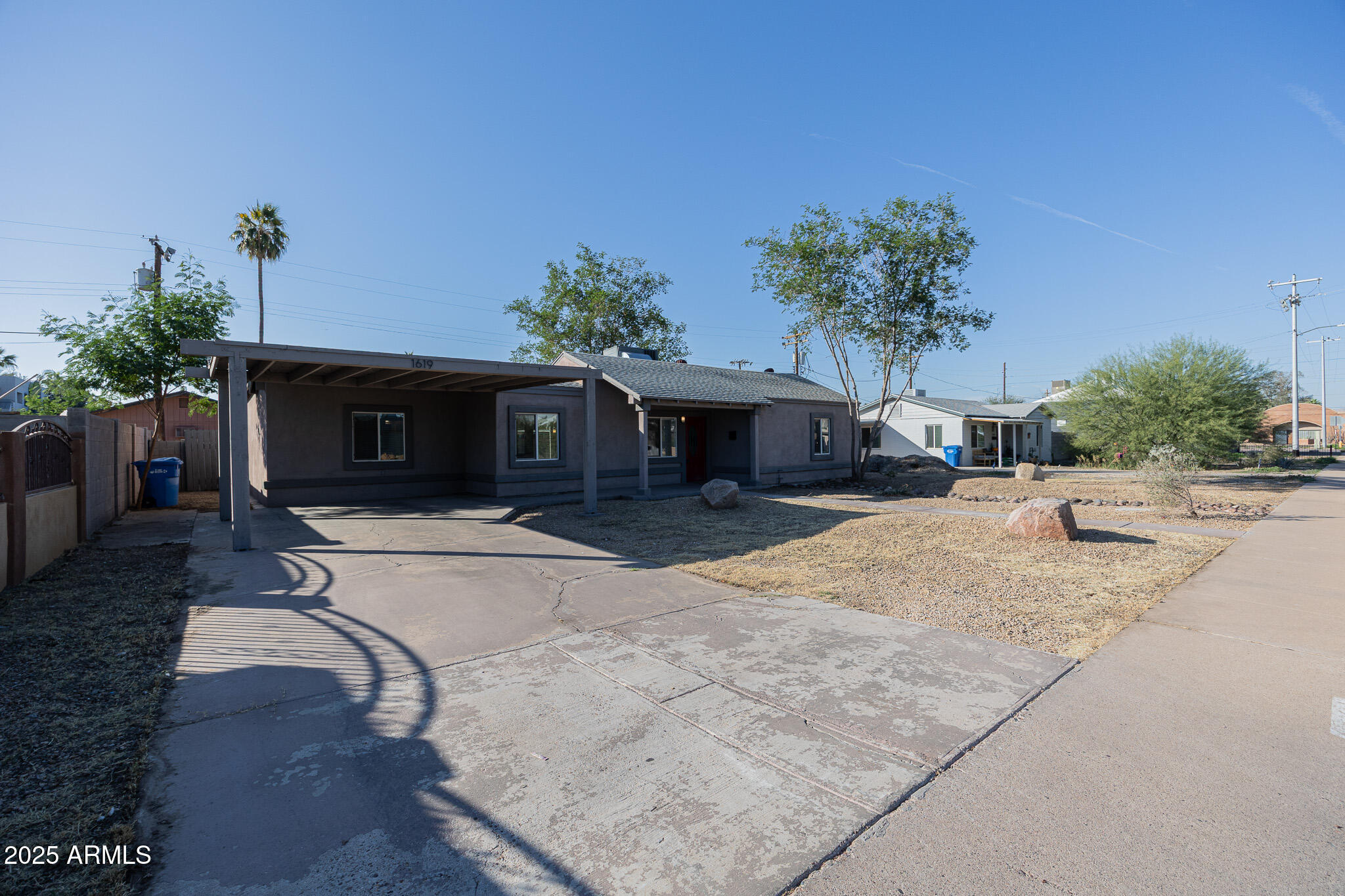 a front view of a house with a yard and a garage