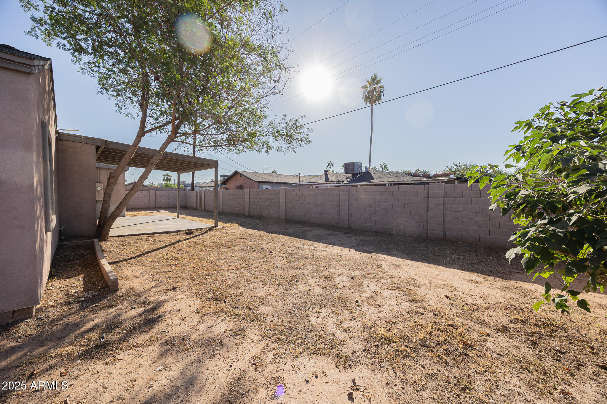 1619 East Whitton Avenue Phoenix, AZ 85016 - Photo 22 of 22 a backyard of a house with lots of green space