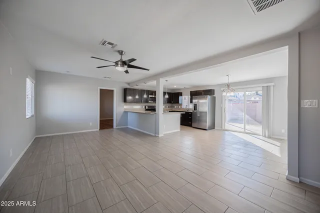 a view of a kitchen with a sink and a stove top oven