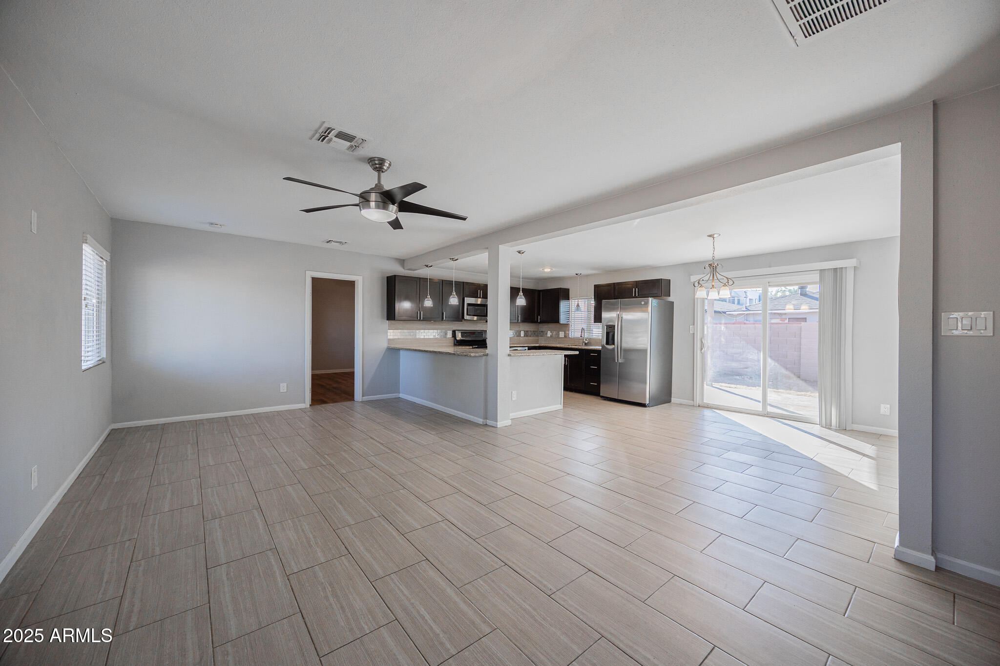 1619 East Whitton Avenue Phoenix, AZ 85016 - Photo 4 of 22 a view of a kitchen with a sink and a stove top oven