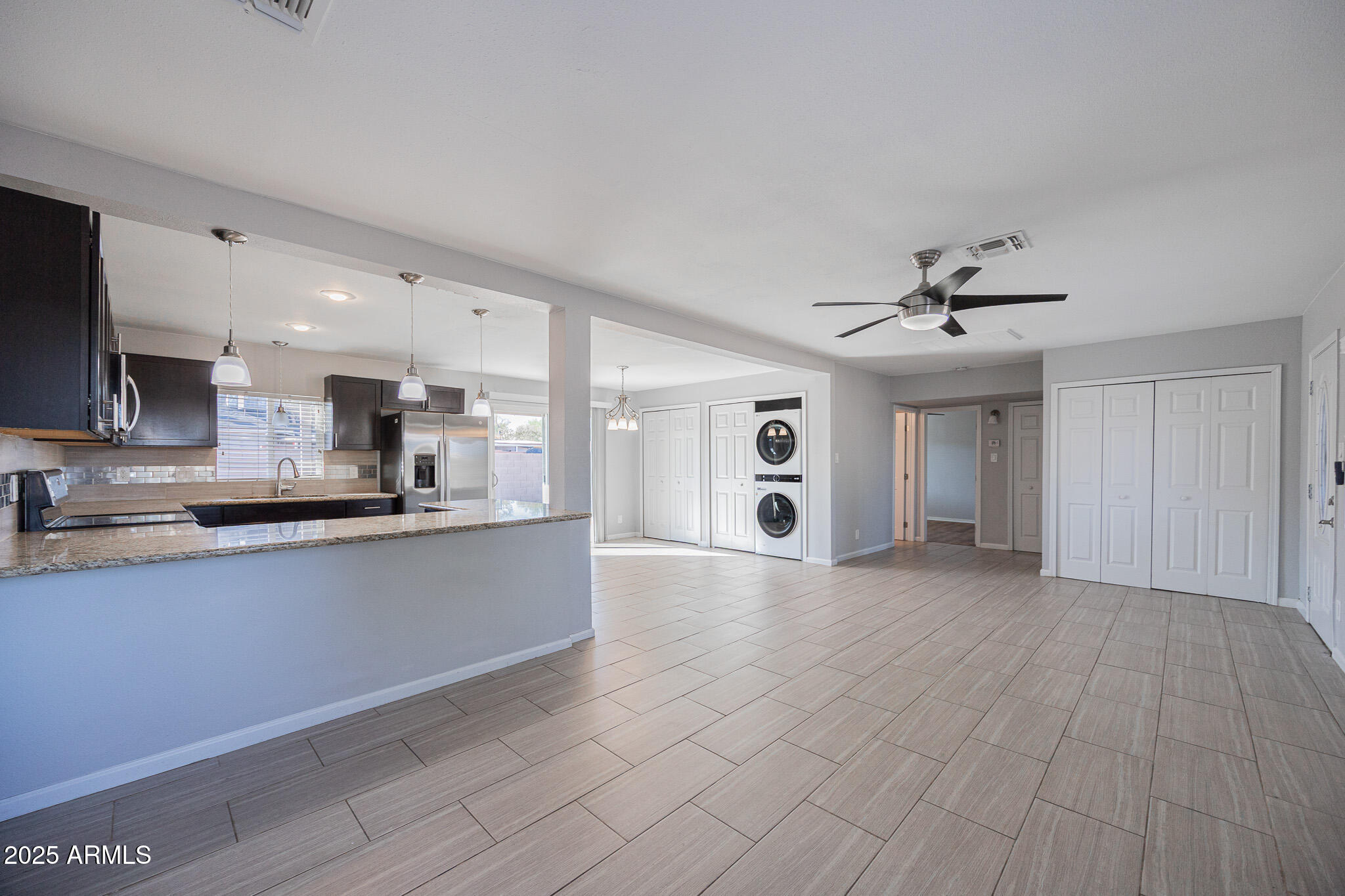 1619 East Whitton Avenue Phoenix, AZ 85016 - Photo 5 of 22 a large kitchen with stainless steel appliances a large counter top a sink a refrigerator and a window