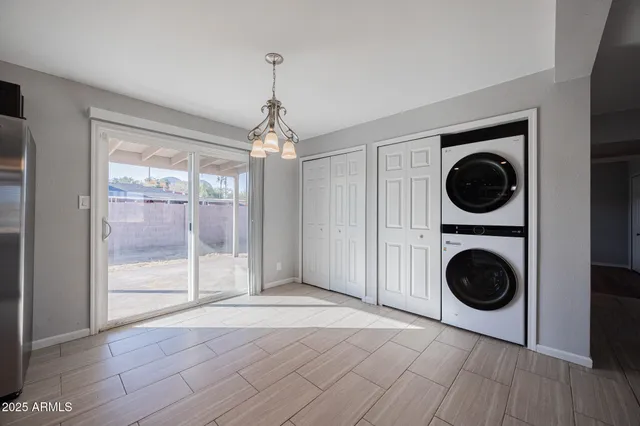 a view of a hallway with washer and dryer