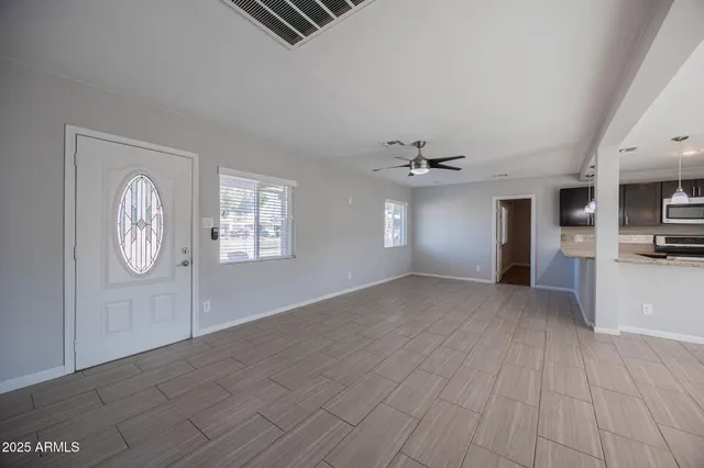 a view of an empty room with a window