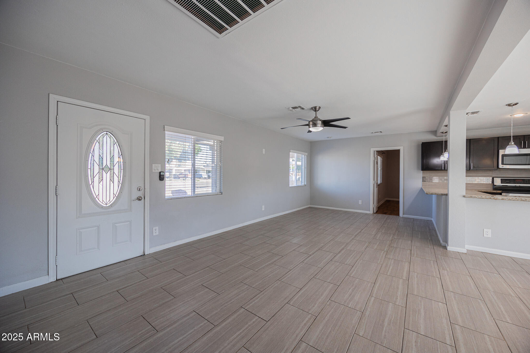 1619 East Whitton Avenue Phoenix, AZ 85016 - Photo 10 of 22 a view of an empty room with a window