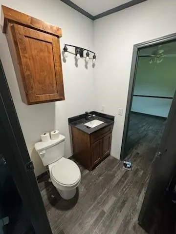 a white toilet sitting next to a shower curtain