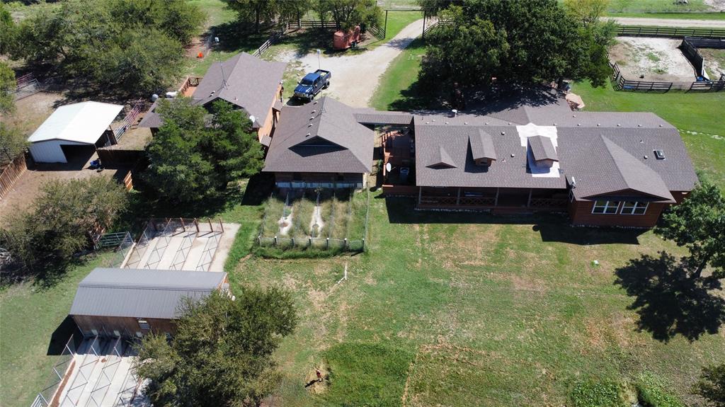 16283 County Road 1004 Blue Ridge, TX 75424 - Photo 3 of 18 an aerial view of a house with garden space and a patio