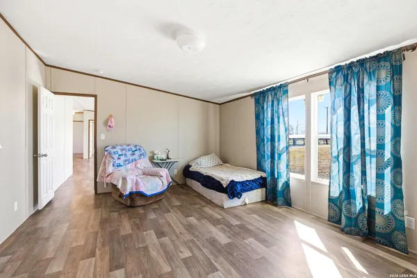 a spacious bathroom with a granite countertop sink mirror and a shower