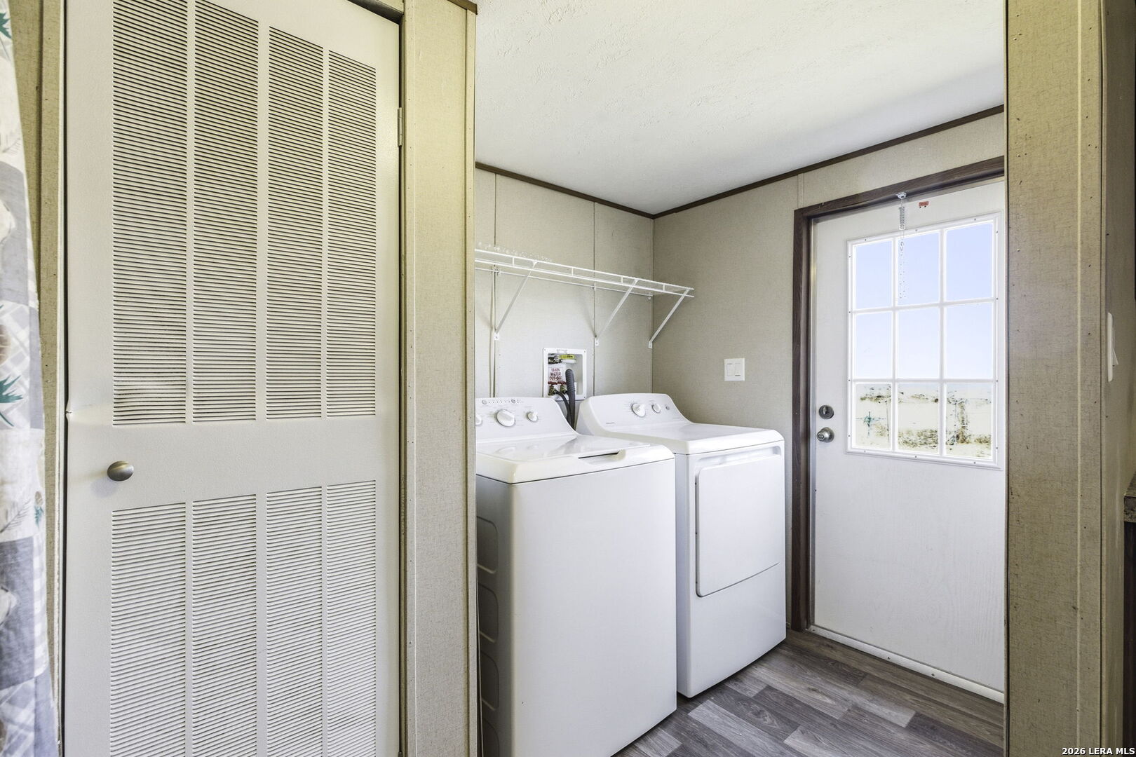393 West County Road 5719 Devine, TX 78016 - Photo 18 of 26 a utility room with dryer and washer