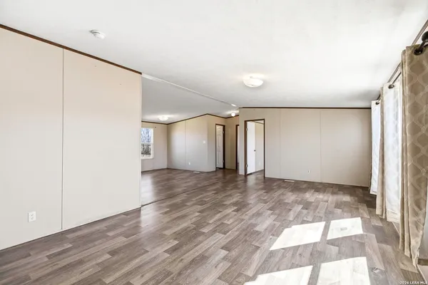 a view of kitchen with window a sink and a refrigerator