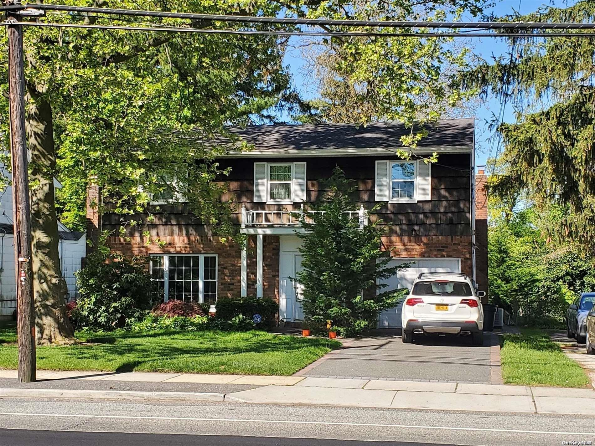 1368 Merrick Avenue Merrick, NY 11566 - Photo 1 of 1 a car parked in front of a house