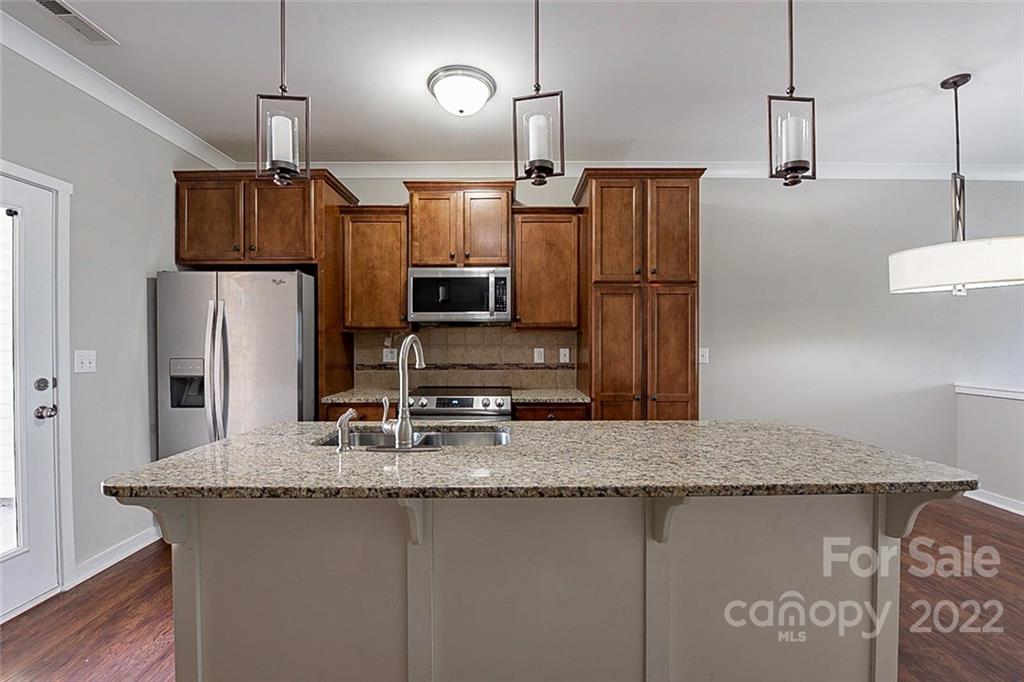 527 Alderman Lane Fort Mill, SC 29715 - Photo 5 of 17 a kitchen with refrigerator a counter space and wooden floor