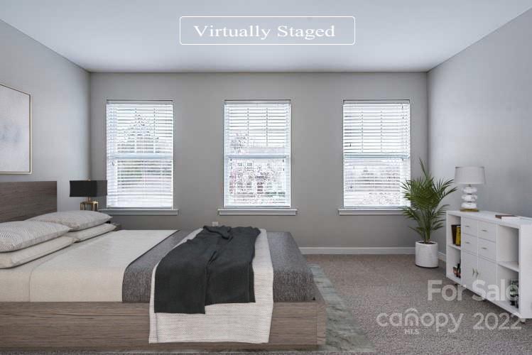 527 Alderman Lane Fort Mill, SC 29715 - Photo 7 of 17 a spacious bedroom with a bed and windows