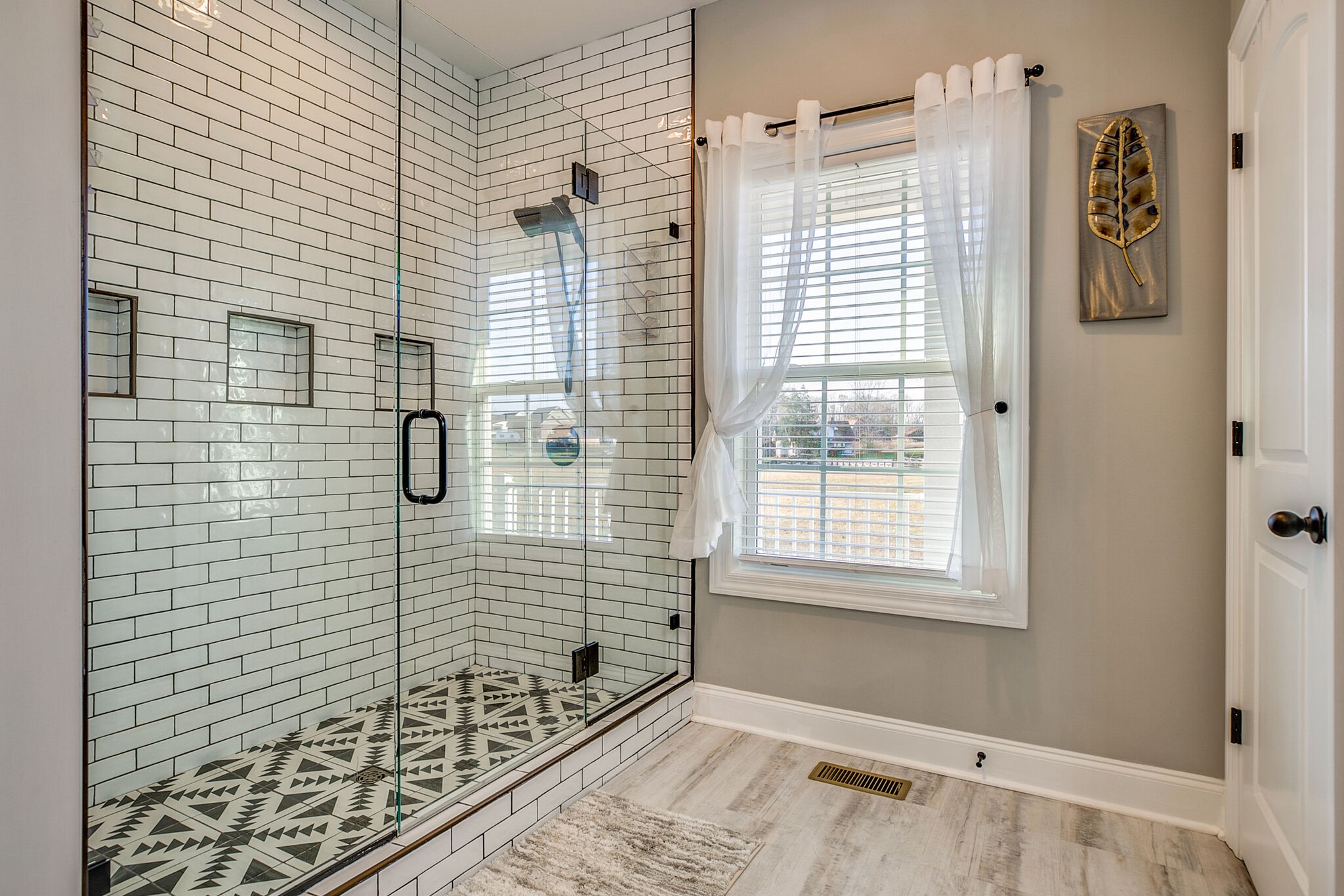 998 Norton Road Manchester, TN 37355 - Photo 29 of 46 a bathroom with a window and a shower