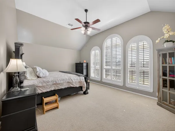 a bathroom with a double vanity sink mirror and toilet