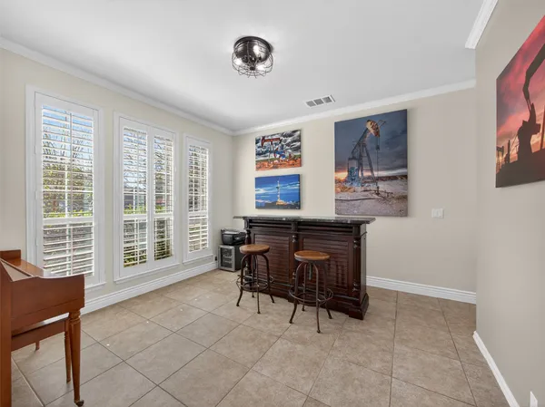 a room with furniture a large window and a flat screen tv