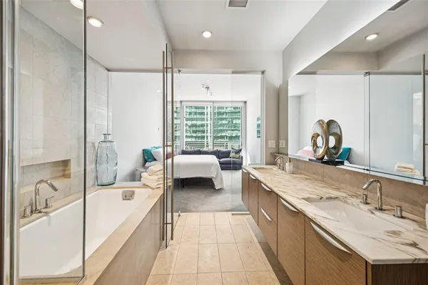 a bathroom with a tub and shower
