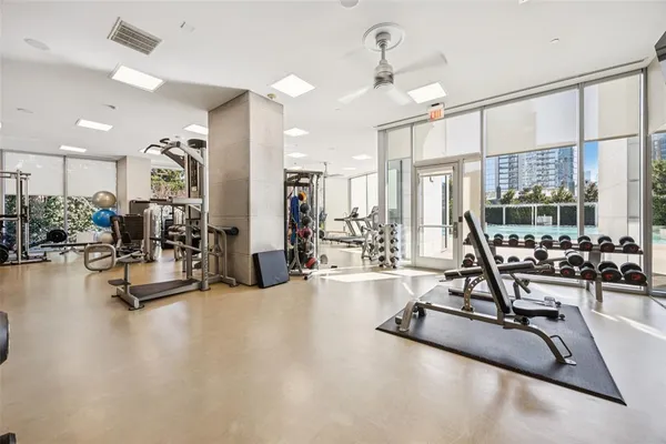 a projector room with furniture and a flat screen tv