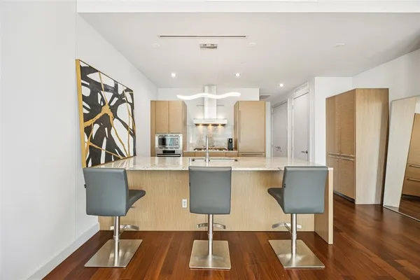 a kitchen with a stove and a refrigerator