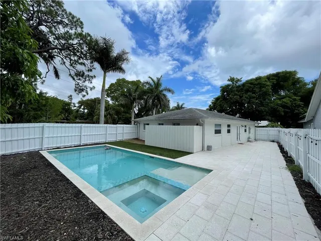 a view of a mini pool with a yard