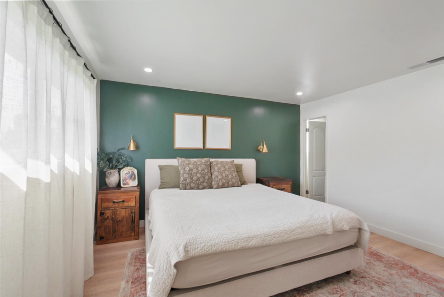 3280 Cheyenne Drive Merced, CA 95348 - Photo 11 of 17 a bedroom with a large bed and a potted plant