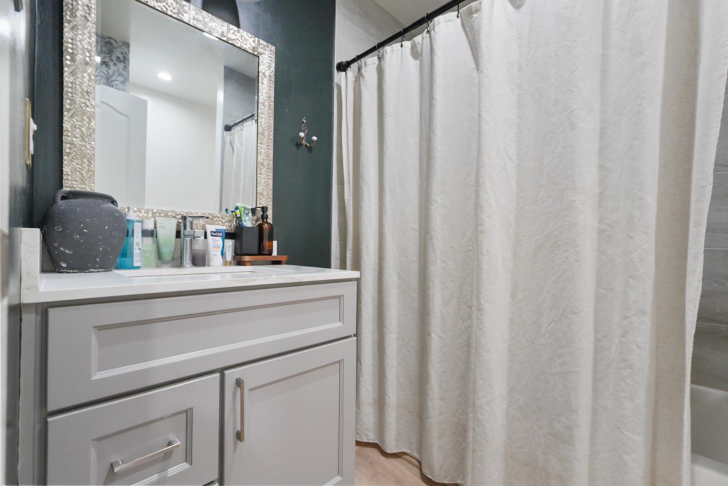 3280 Cheyenne Drive Merced, CA 95348 - Photo 14 of 17 a bathroom with a sink and a mirror