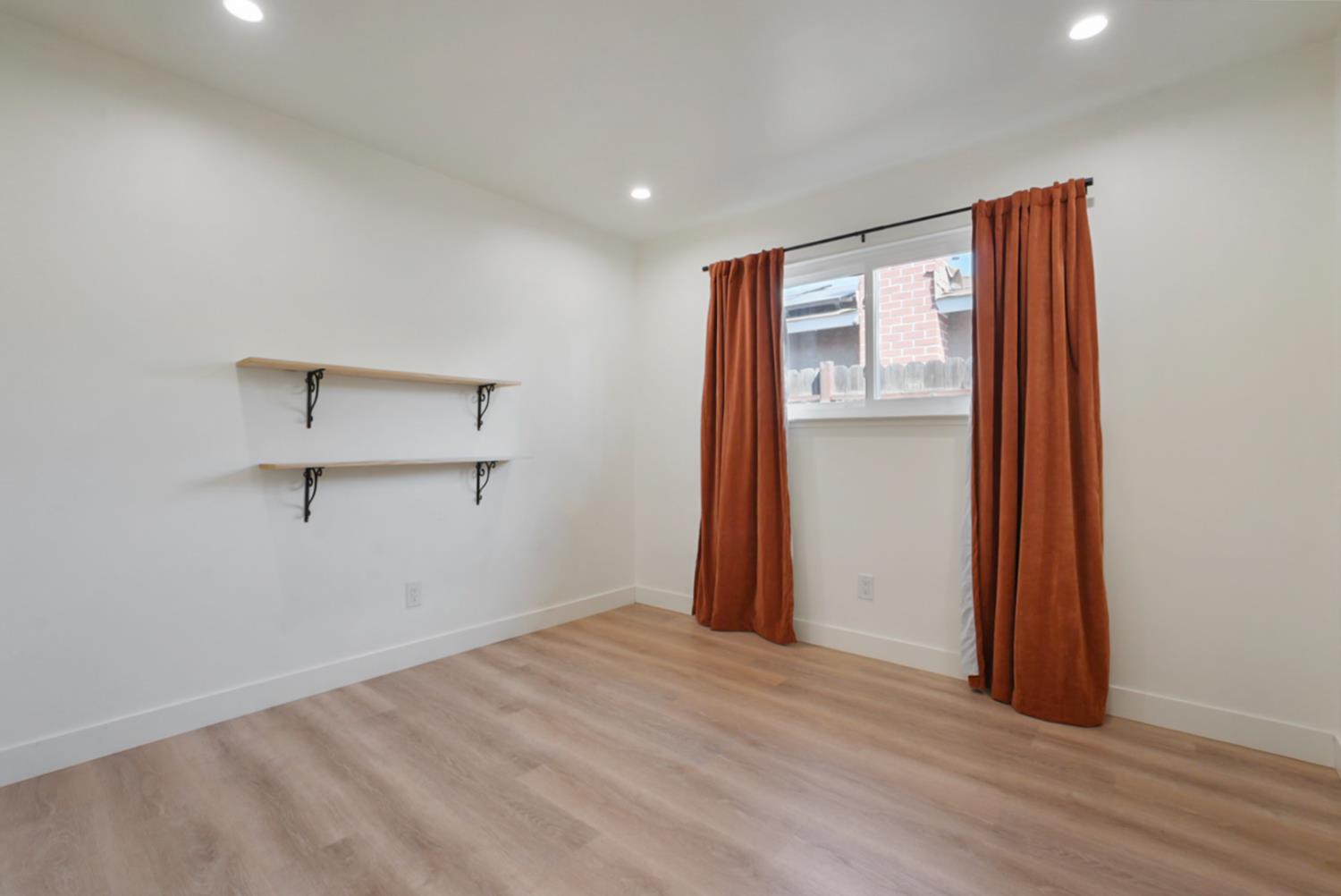 3280 Cheyenne Drive Merced, CA 95348 - Photo 9 of 17 a view of empty room with wooden floor and fan