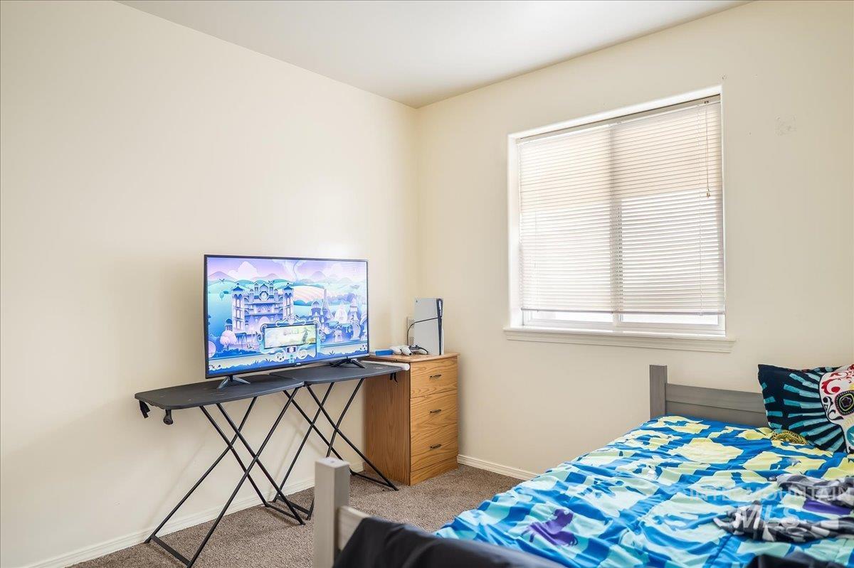 215 Little Cedar Street Hansen, ID 83334 - Photo 16 of 26 Bedroom with carpet flooring and baseboards
